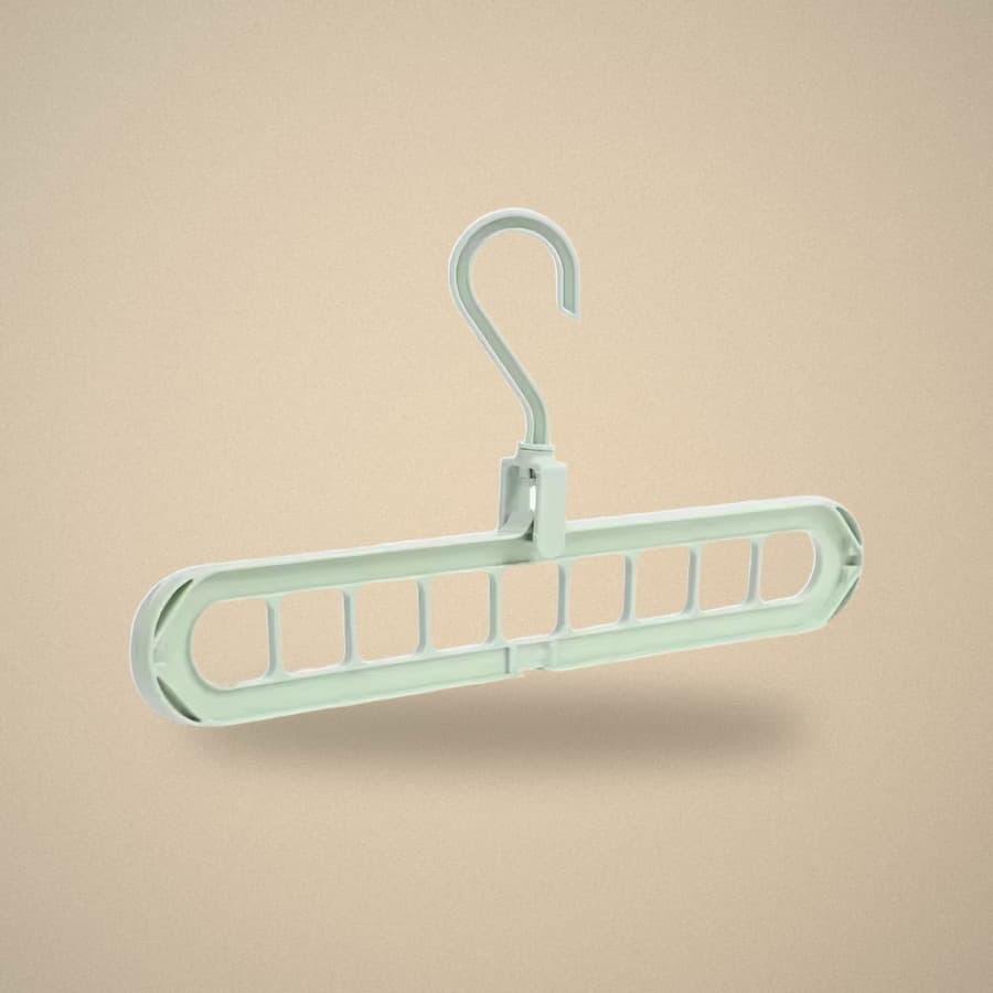 Studio shot of the sage green nine-slot hanger showing the rotating hook and oval cutouts